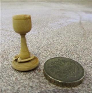 A miniature goblet with a captive ring